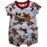 A baby short-sleeve romper in light blue with a red crew neck, featuring an all-over print of gingerbread men, dachshunds, candy canes, and the letters 'P.A'.